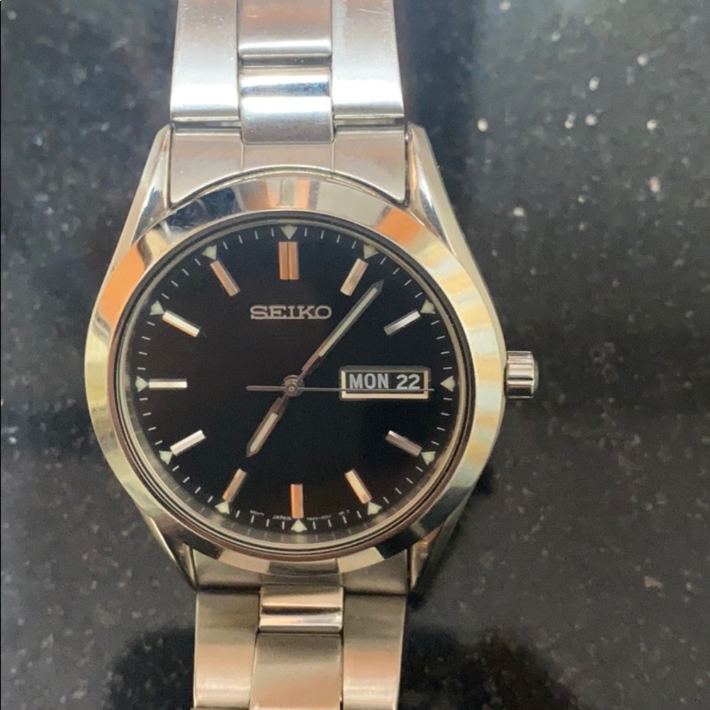 Seiko black face watch, stainless steel band